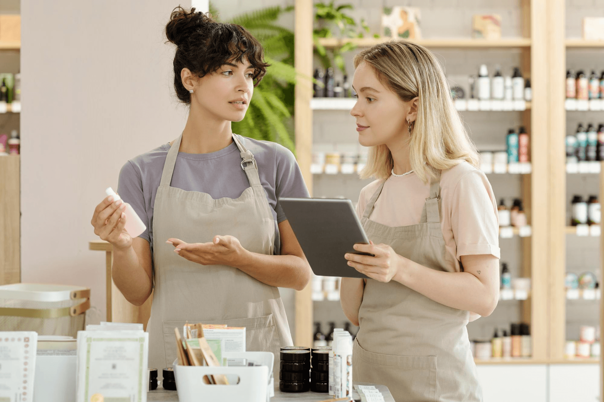 Beauty professionals discussing cosmetic products